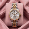 Front view of silver-dial Datejust 31 with diamond-style hour markers, fluted gold-tone bezel and two-tone Jubilee bracelet