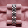 Rear view of stainless-steel Jubilee bracelet with crown clasp on pink cushion