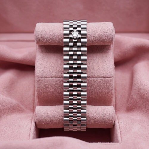 Rear view of stainless-steel Jubilee bracelet with crown clasp on pink cushion