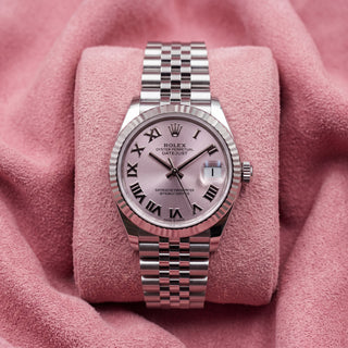 Front view of pink-dial Datejust 31 with Roman-numeral markers, fluted bezel and Jubilee bracelet