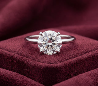 Platinum brilliant cut diamond solitaire engagement ring with four-claw setting, front view