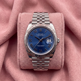 Rolex Datejust 41 with blue Roman numeral dial, fluted bezel and Jubilee bracelet on a pink cushion
