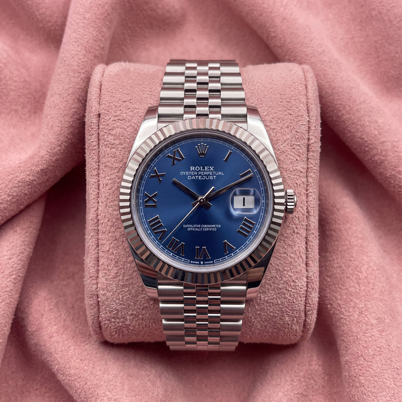 Rolex Datejust 41 with blue Roman numeral dial, fluted bezel and Jubilee bracelet on a pink cushion