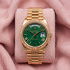 Rolex Day-Date 40 228238 with green dial, yellow gold fluted bezel and President bracelet