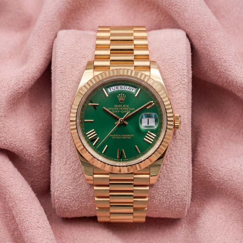 Rolex Day-Date 40 228238 with green dial, yellow gold fluted bezel and President bracelet