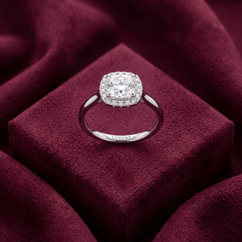 Cushion halo diamond engagement ring standing upright