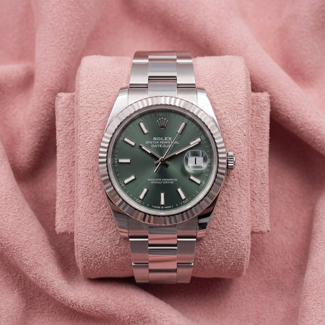 Rolex Datejust 41 with mint green dial, fluted bezel and Oyster bracelet on a pink cushion