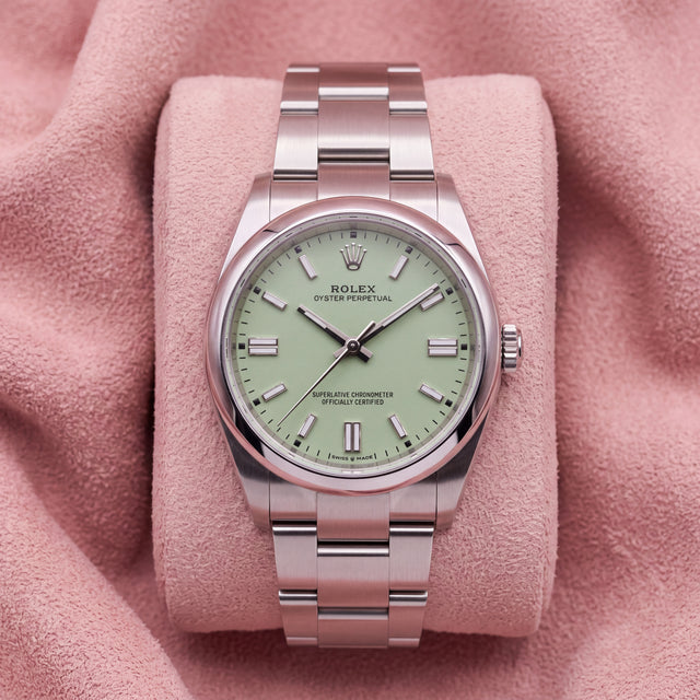 Rolex Oyster Perpetual 41 with pistachio dial and Oyster bracelet on a pink cushion