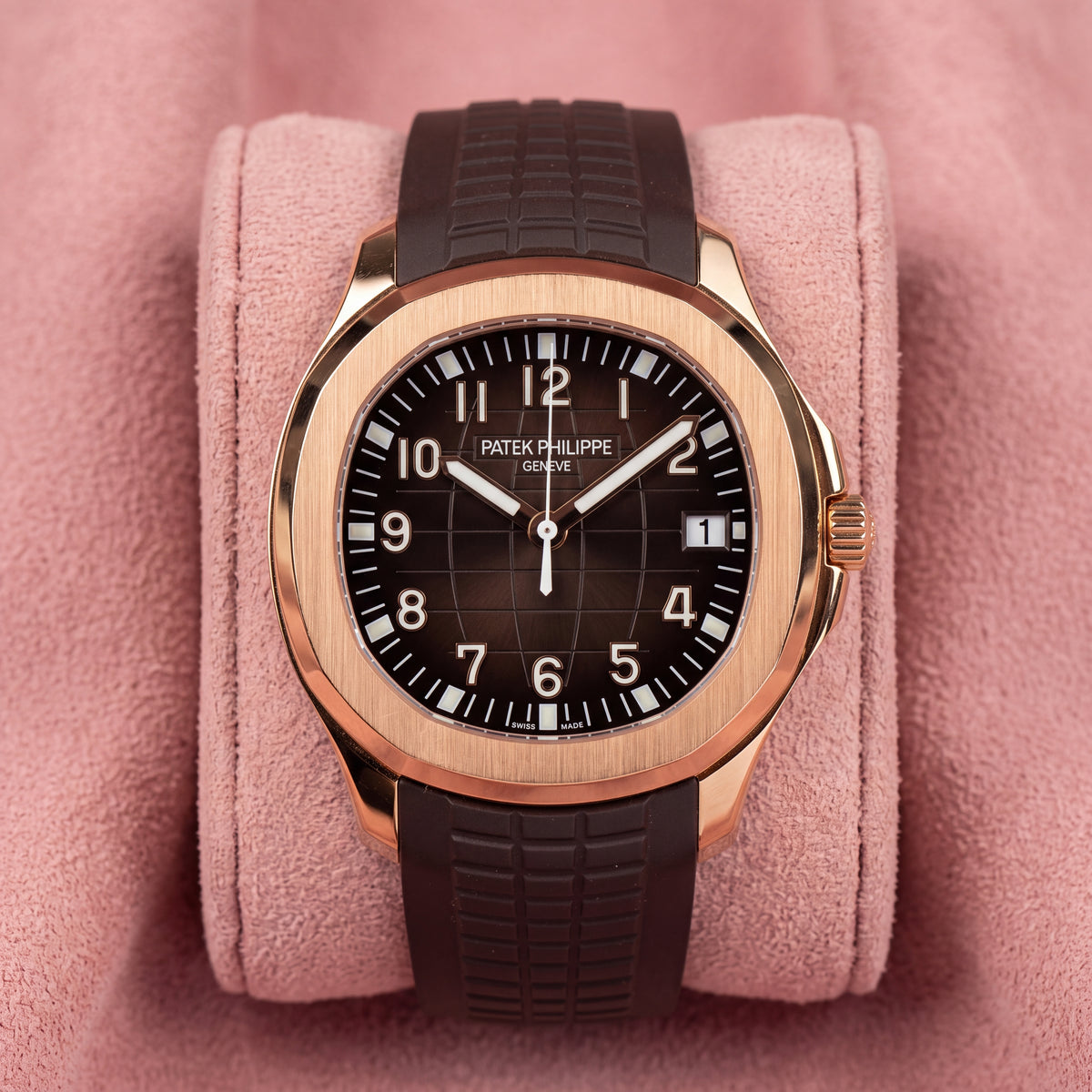 Patek Philippe Aquanaut 5167R-001 with rose-toned case, brown patterned dial and textured brown strap on a pink cushion