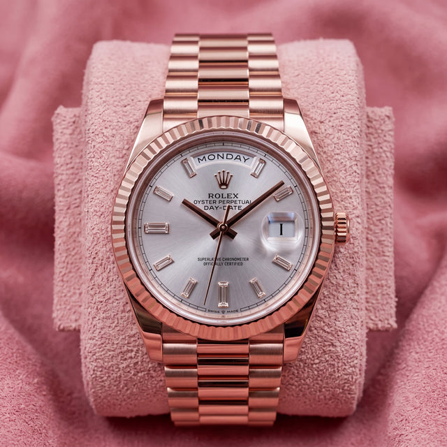 Rolex Day-Date 40 228235 with Sundust baguette dial and rose gold fluted bezel